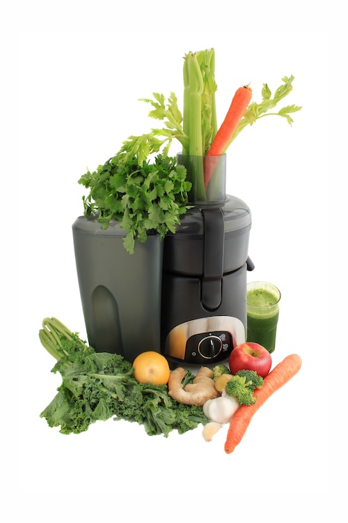 Juicing fresh vegetables and fruit